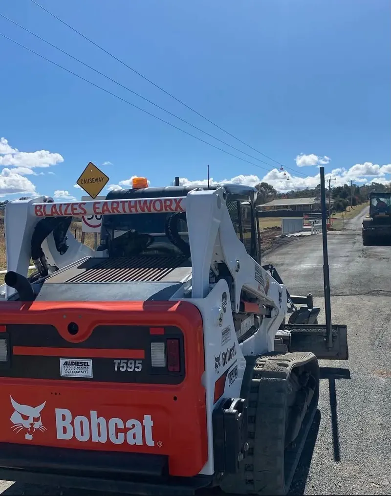 Blaizes Bobcat T595 posi track loader on a road job